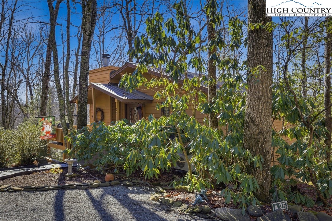 25 Poke Road Newland, NC 28657 - Photo 7 of 33 a view of a house with a tree and sitting area