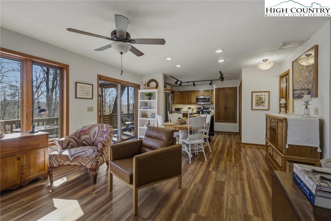 25 Poke Road Newland, NC 28657 - Photo 9 of 33 a living room with furniture a flat screen tv and a floor to ceiling window