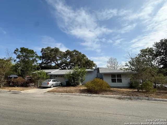 a view of a house with a street