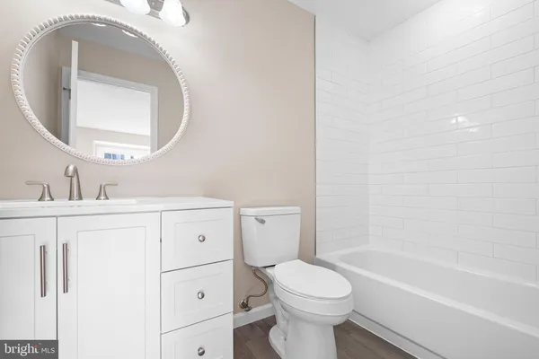 a bathroom with a sink a toilet and a bathtub
