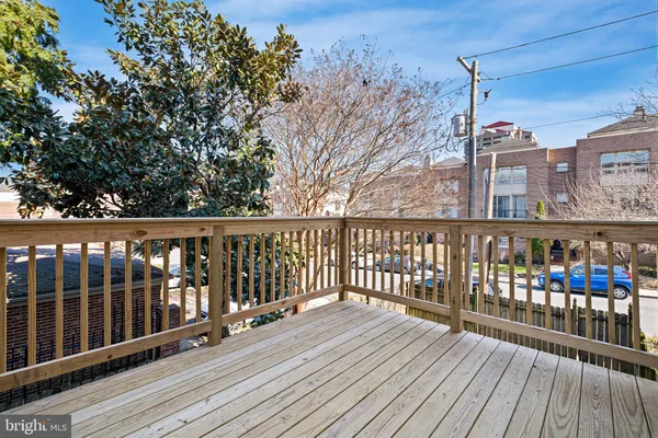a view of house with a yard and furniture