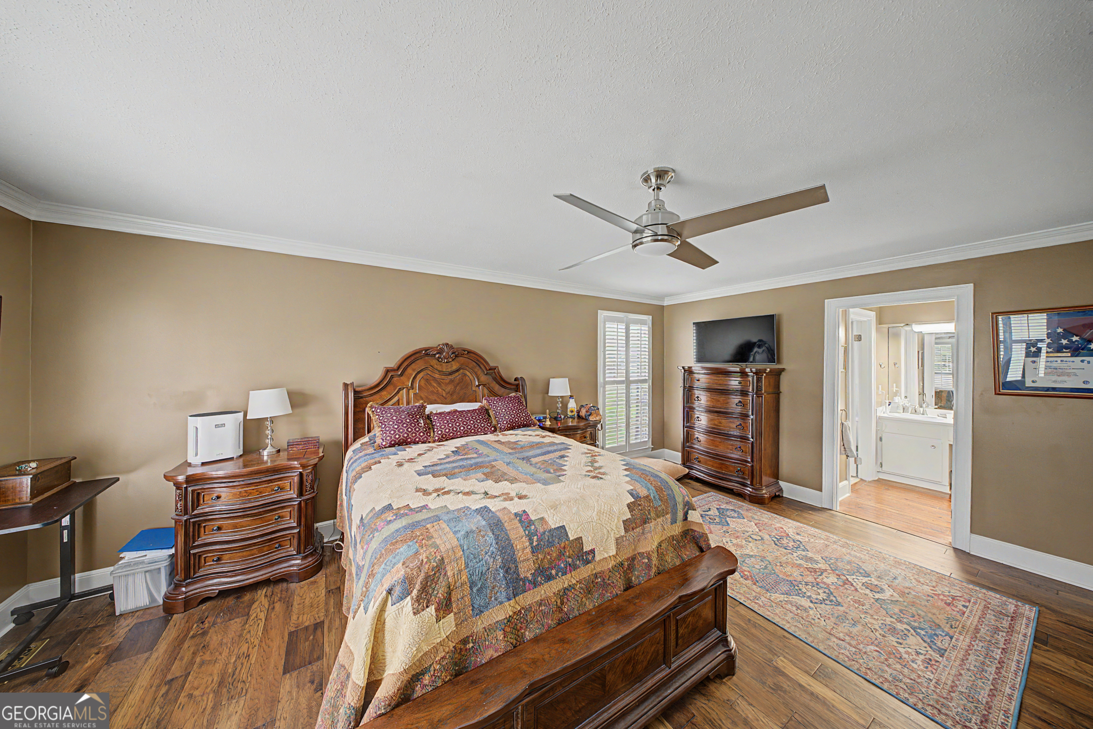 306 Holly Trail Moultrie, GA 31768 - Photo 12 of 40 a bedroom with a bed and wooden floor