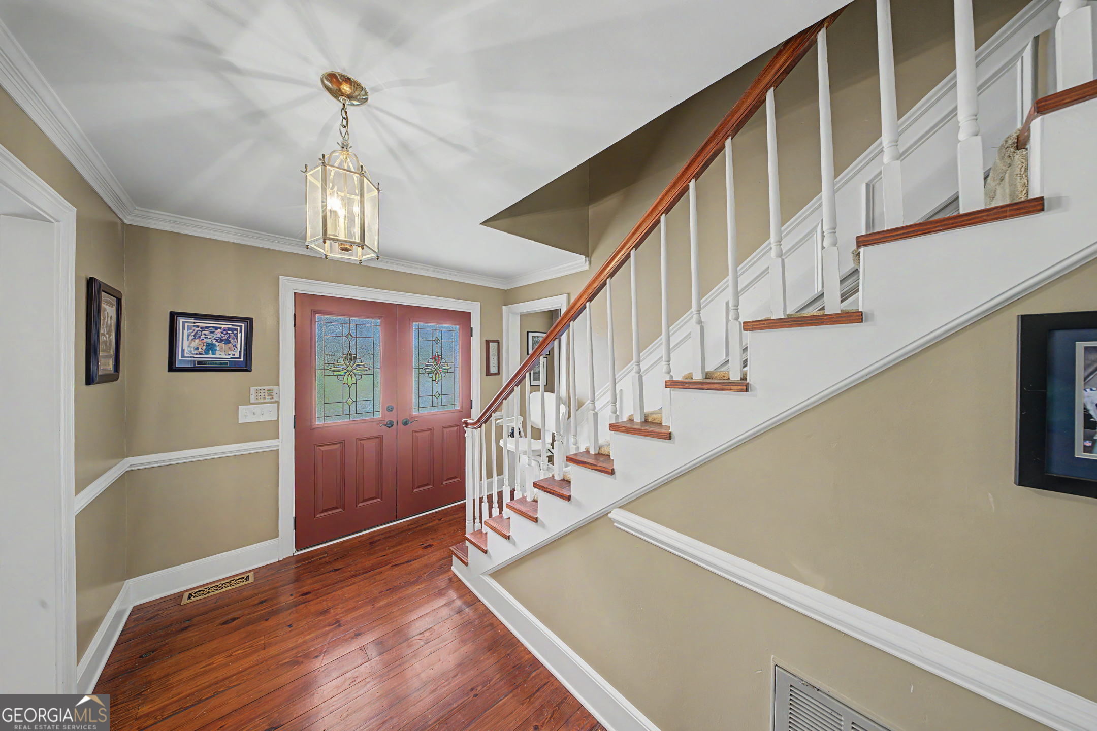 306 Holly Trail Moultrie, GA 31768 - Photo 2 of 40 a view of entryway and hall with wooden floor