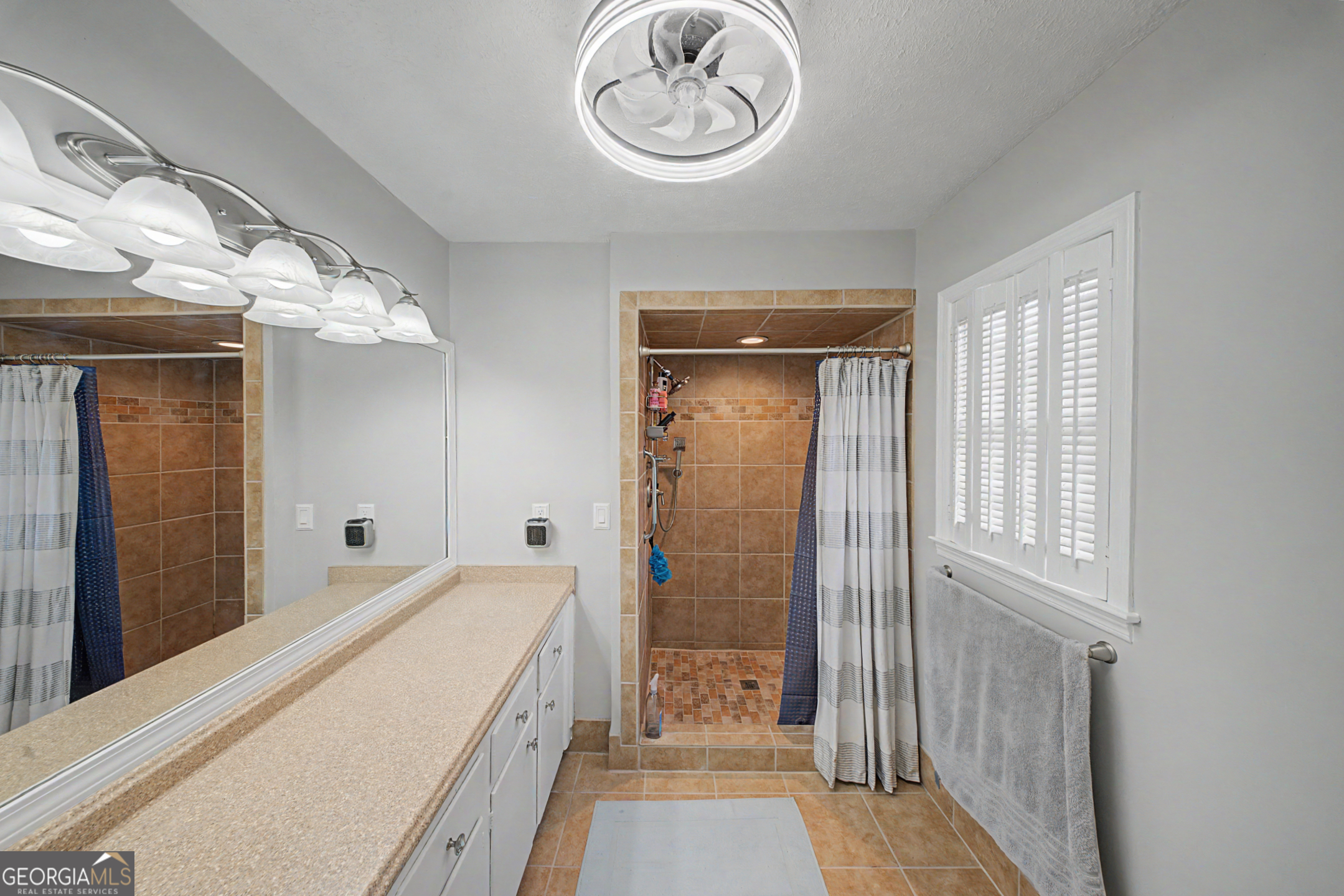 306 Holly Trail Moultrie, GA 31768 - Photo 21 of 40 a spacious bathroom with a double vanity sink and a mirror