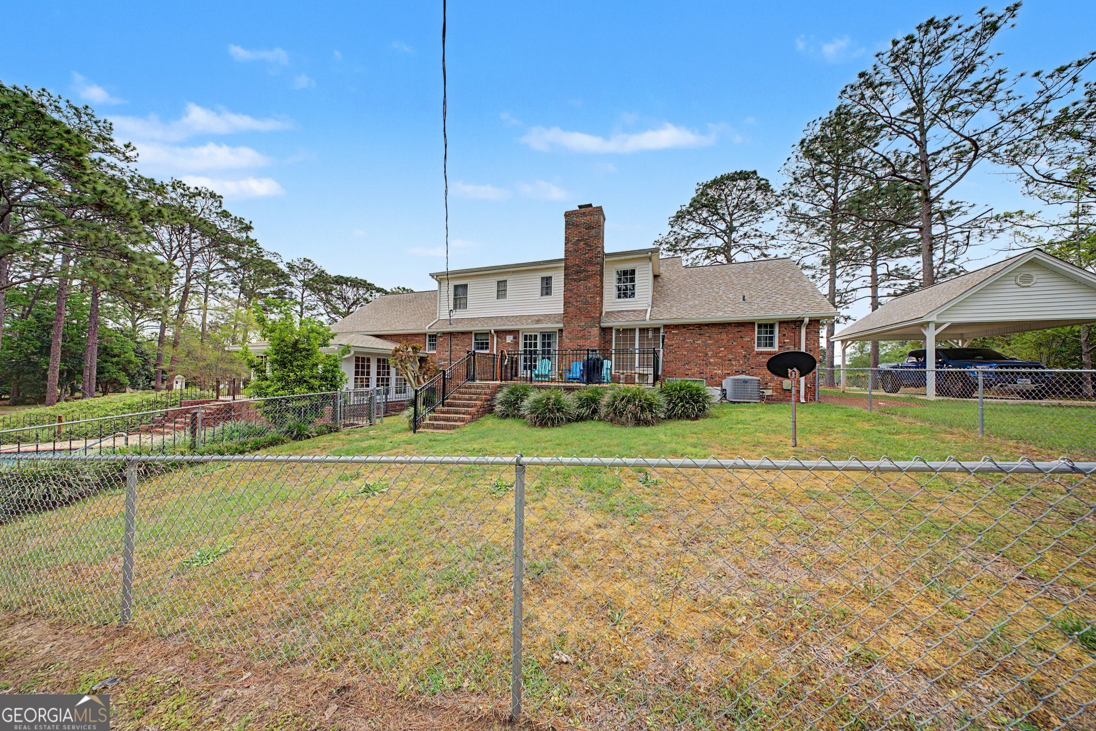 306 Holly Trail Moultrie, GA 31768 - Photo 35 of 40 a view of a big house with a big yard and large trees