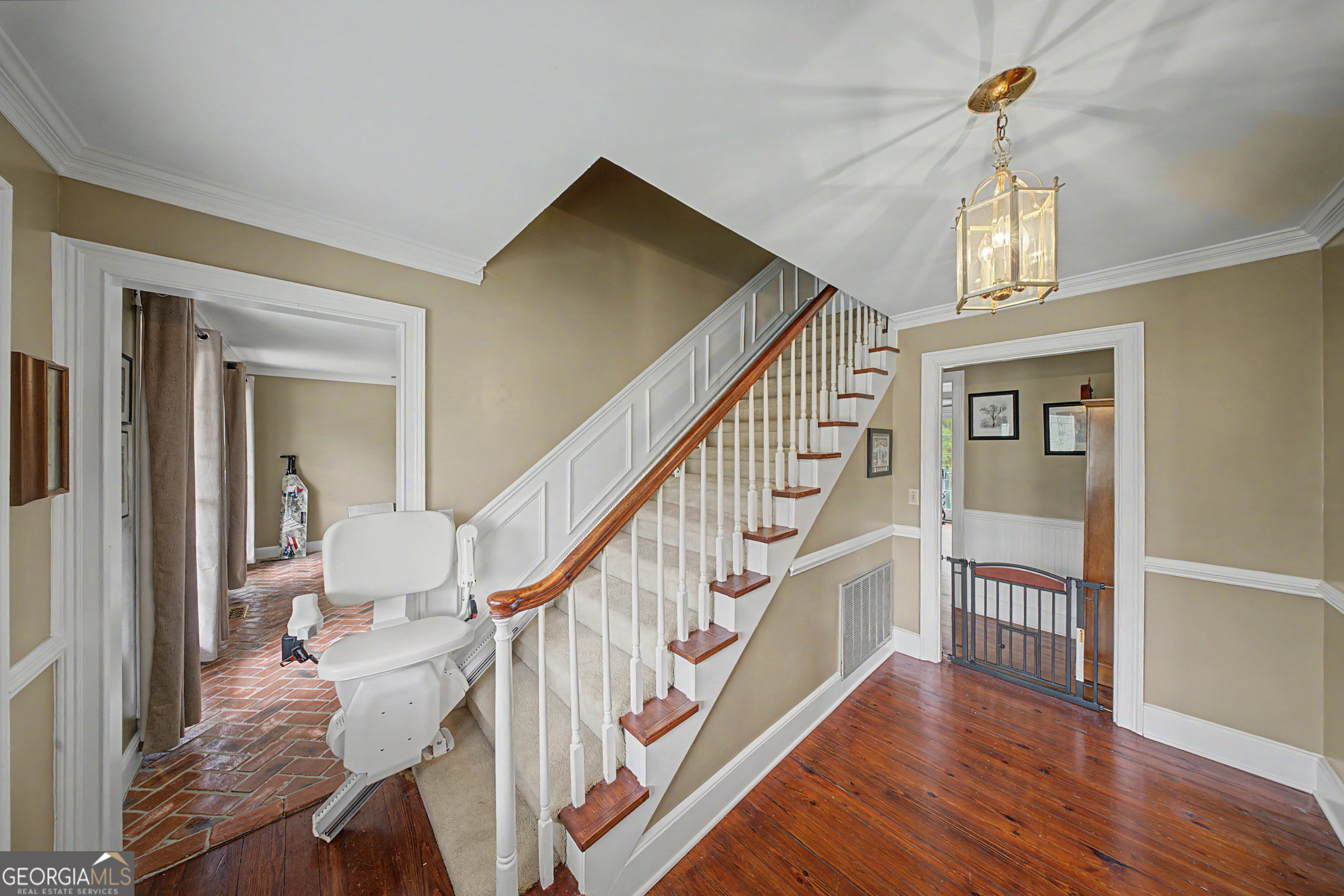 306 Holly Trail Moultrie, GA 31768 - Photo 4 of 40 a view of staircase with wooden floor and a chandelier