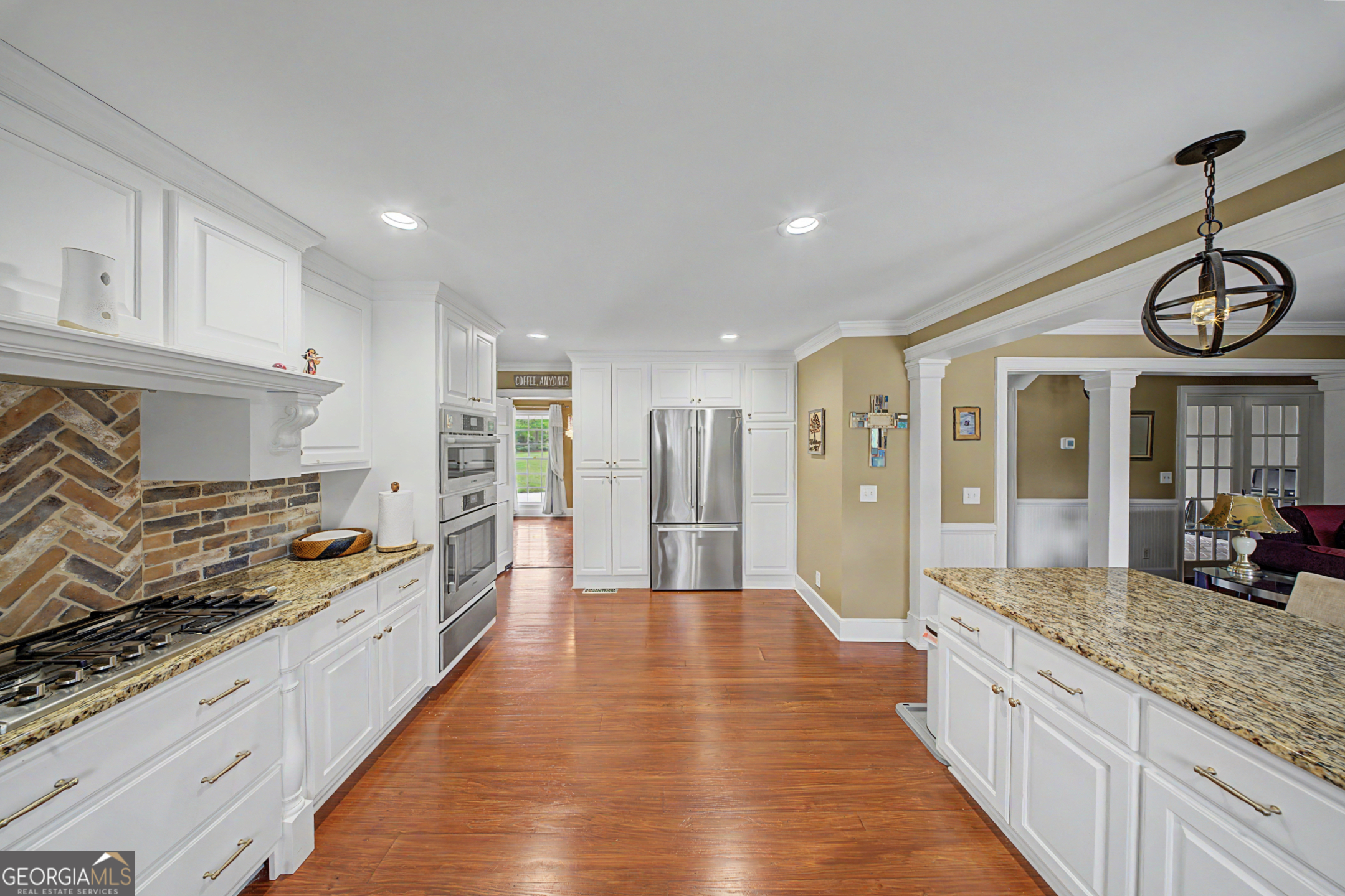 306 Holly Trail Moultrie, GA 31768 - Photo 7 of 40 a large kitchen with stainless steel appliances granite countertop a stove and cabinets