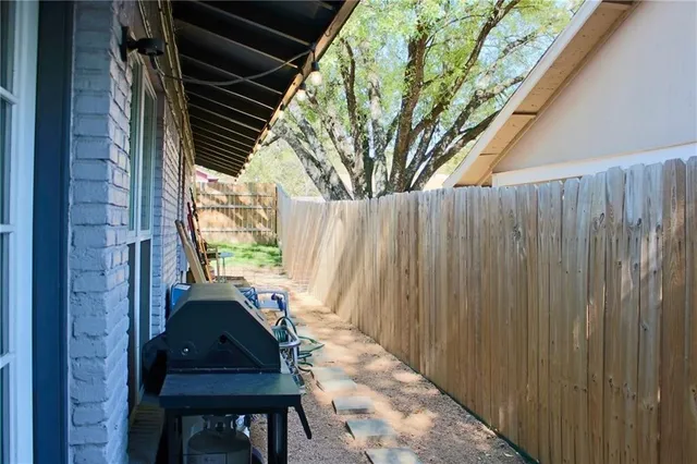 a view of a chairs and table in the balcony