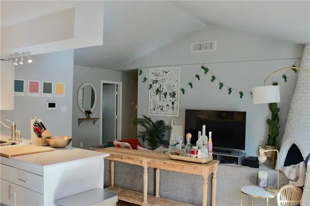 a bedroom with a bed and a table chair