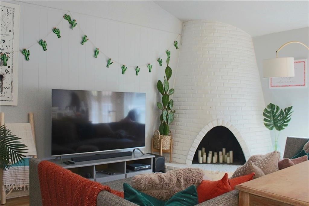 1511 Rutland Drive, Unit A Austin, TX 78758 - Photo 3 of 16 a living room with furniture and a potted plant