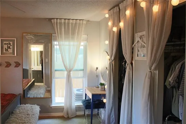 a view of a livingroom with furniture and front door