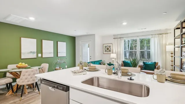 a kitchen with a sink stove and microwave