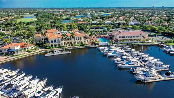 an aerial view of a house with a lake view