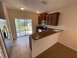 a kitchen with a sink and a refrigerator