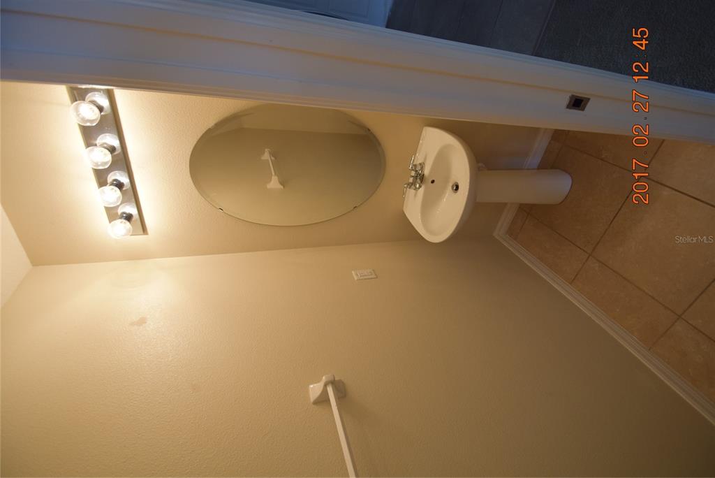 5221 Windsor Lake Circle Sanford, FL 32773 - Photo 8 of 15 a picture of a bathroom with a sink and mirror