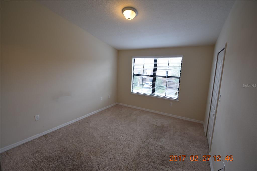 5221 Windsor Lake Circle Sanford, FL 32773 - Photo 9 of 15 an empty room with windows and entrance