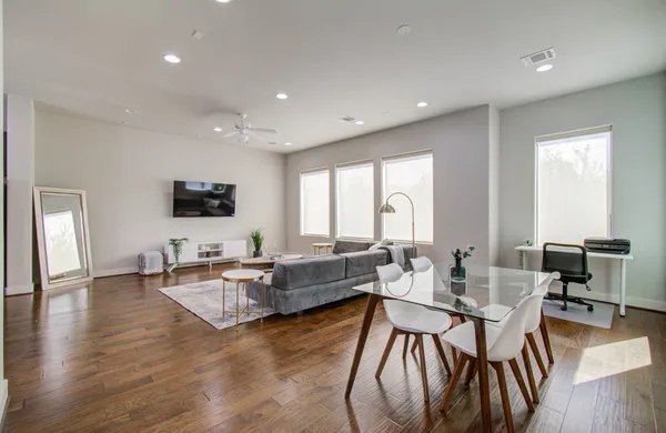 a living room with fireplace furniture and a flat screen tv