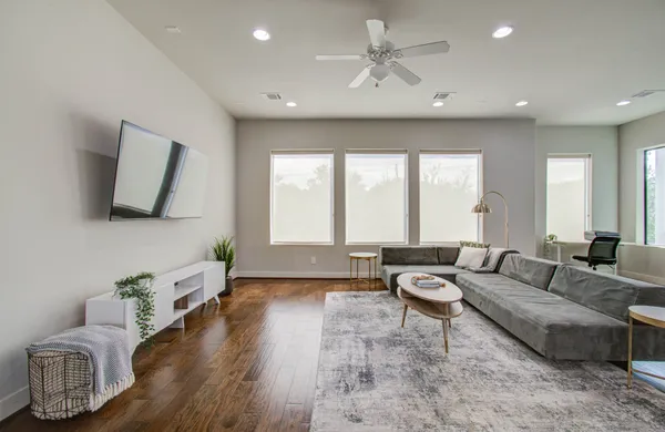 a living room with furniture and a large window