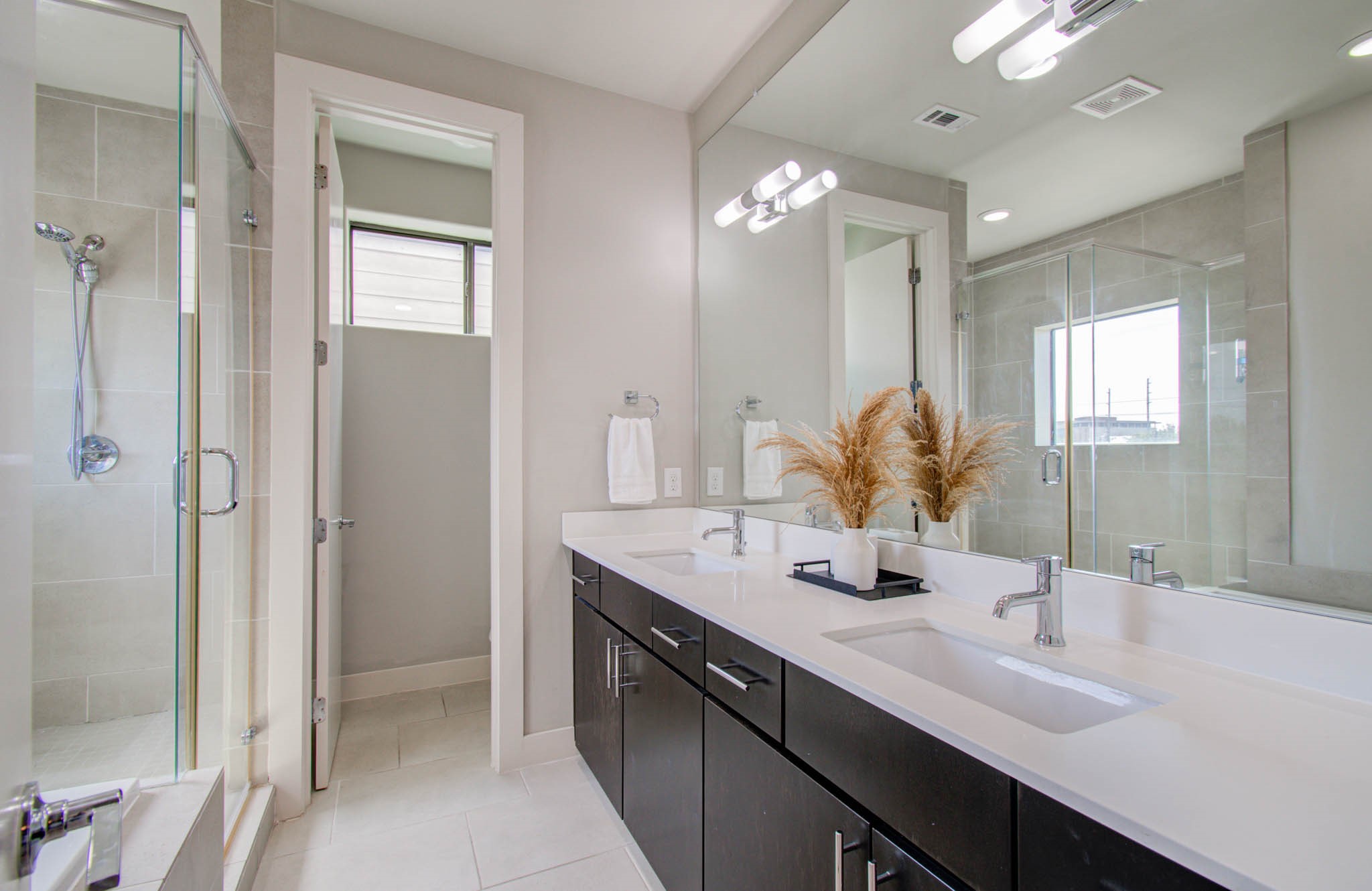 509 Gregg Street Houston, TX 77020 - Photo 29 of 38 a bathroom with a double vanity sink mirror and shower