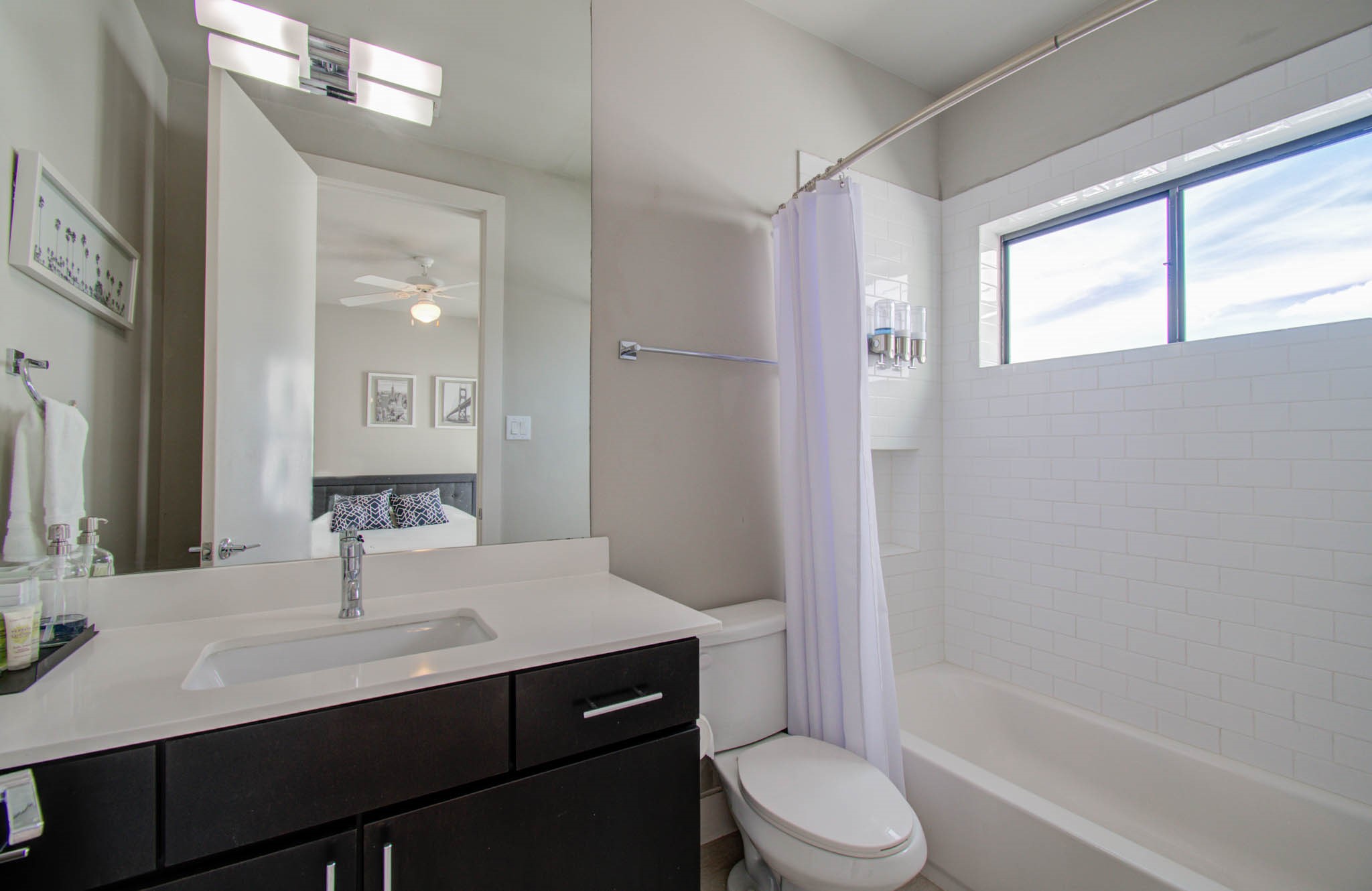 509 Gregg Street Houston, TX 77020 - Photo 34 of 38 a bathroom with a sink a toilet a mirror and shower