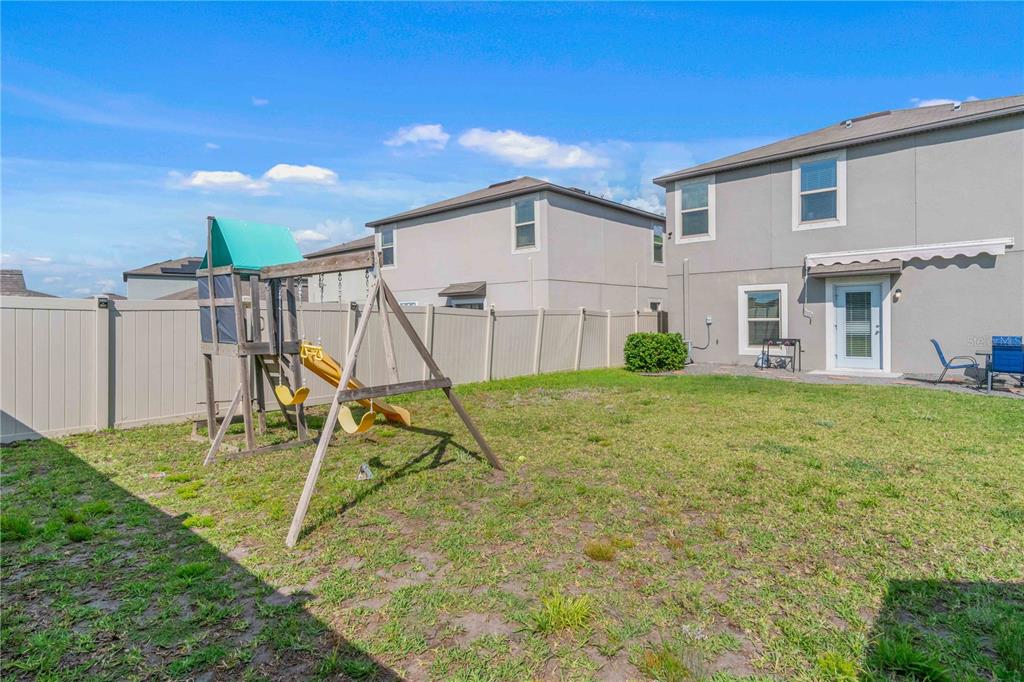 9440 Lemon Drop Loop Sun City Center, FL 33573 - Photo 49 of 55 a house view with a garden space