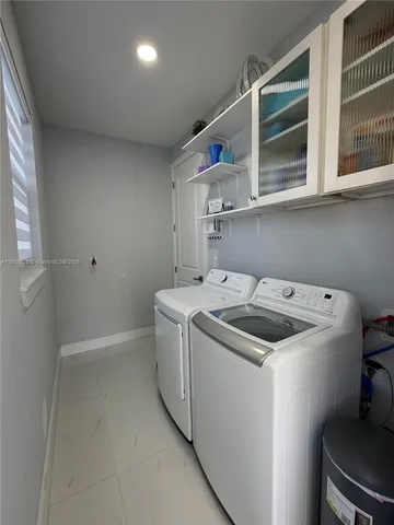 a utility room with dryer and washer