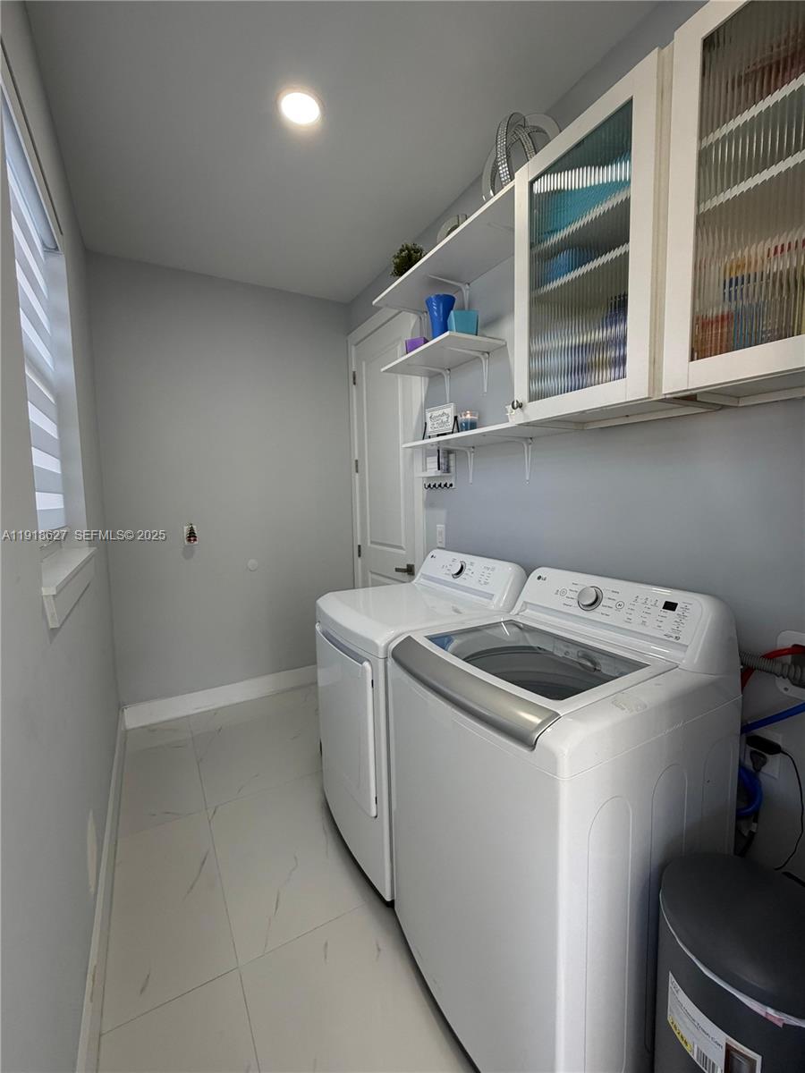 2923 22nd Street Southwest Lehigh Acres, FL 33976 - Photo 20 of 24 a utility room with dryer and washer