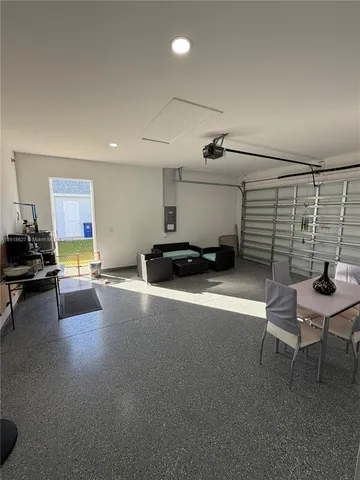 a living room with furniture gym equipment and a couch