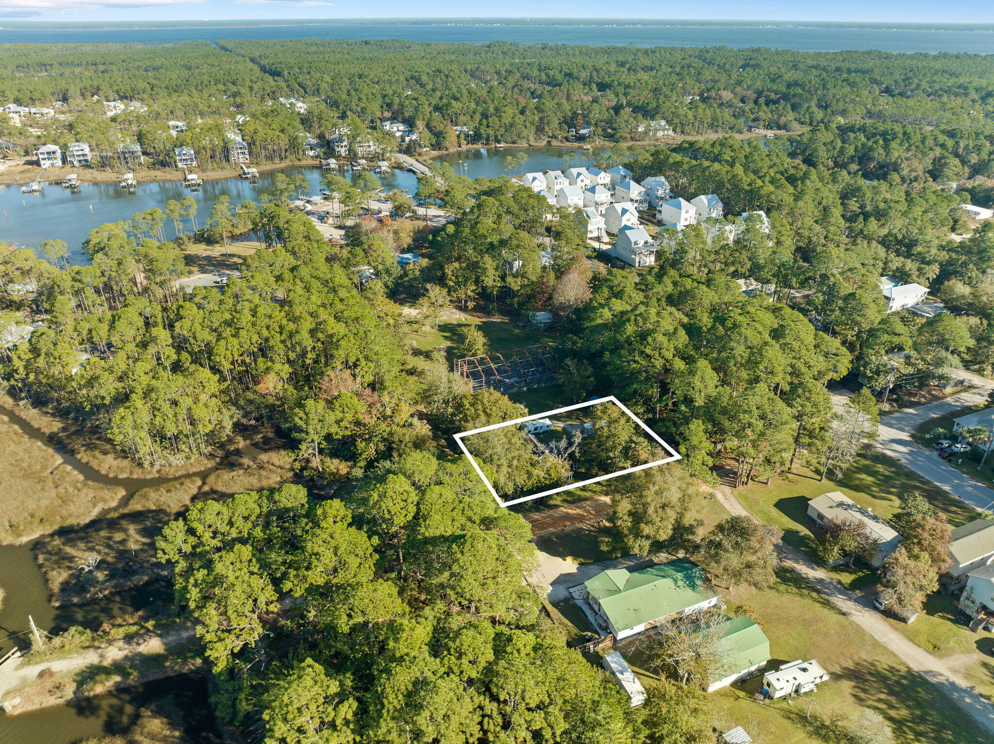 52 West Wilson Street Santa Rosa Beach, FL 32459 - Photo 3 of 29 an aerial view of residential houses with outdoor space and swimming pool