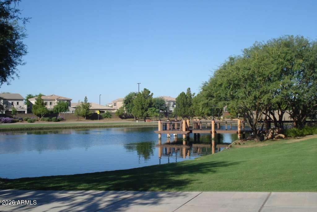 4168 East Sandy Way Gilbert, AZ 85297 - Photo 36 of 47 a view of a lake with a yard and outdoor seating