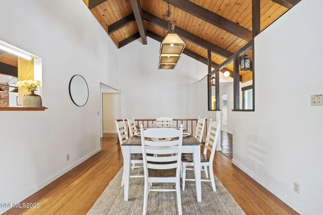 a bathroom with a sink a toilet and shower curtain