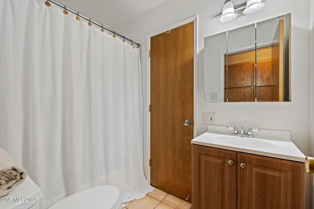 a view of a balcony with wooden floor