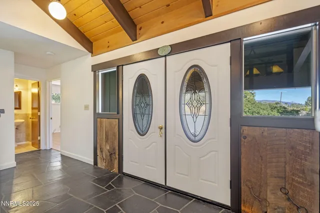 a dining room with a table and chairs