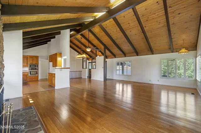a room with pool table and a rug