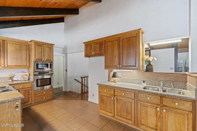 a view of a dining room with furniture and a window