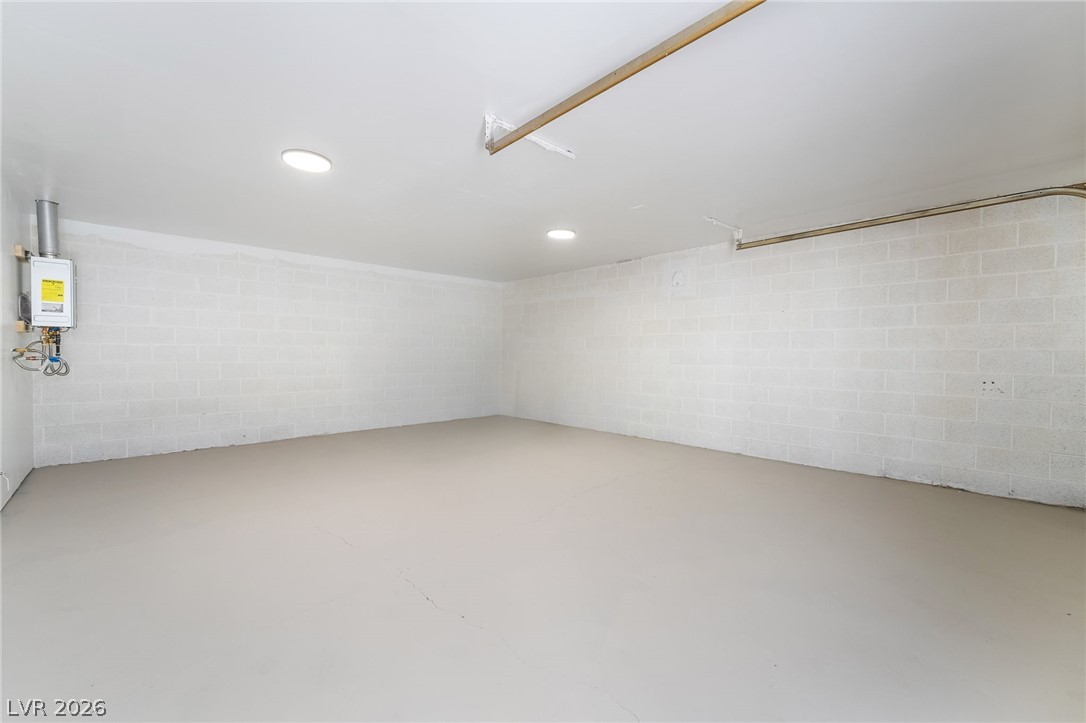 39 Lowery Street Henderson, NV 89015 - Photo 27 of 40 A spacious, unfinished basement offers endless possibilities for future customization.