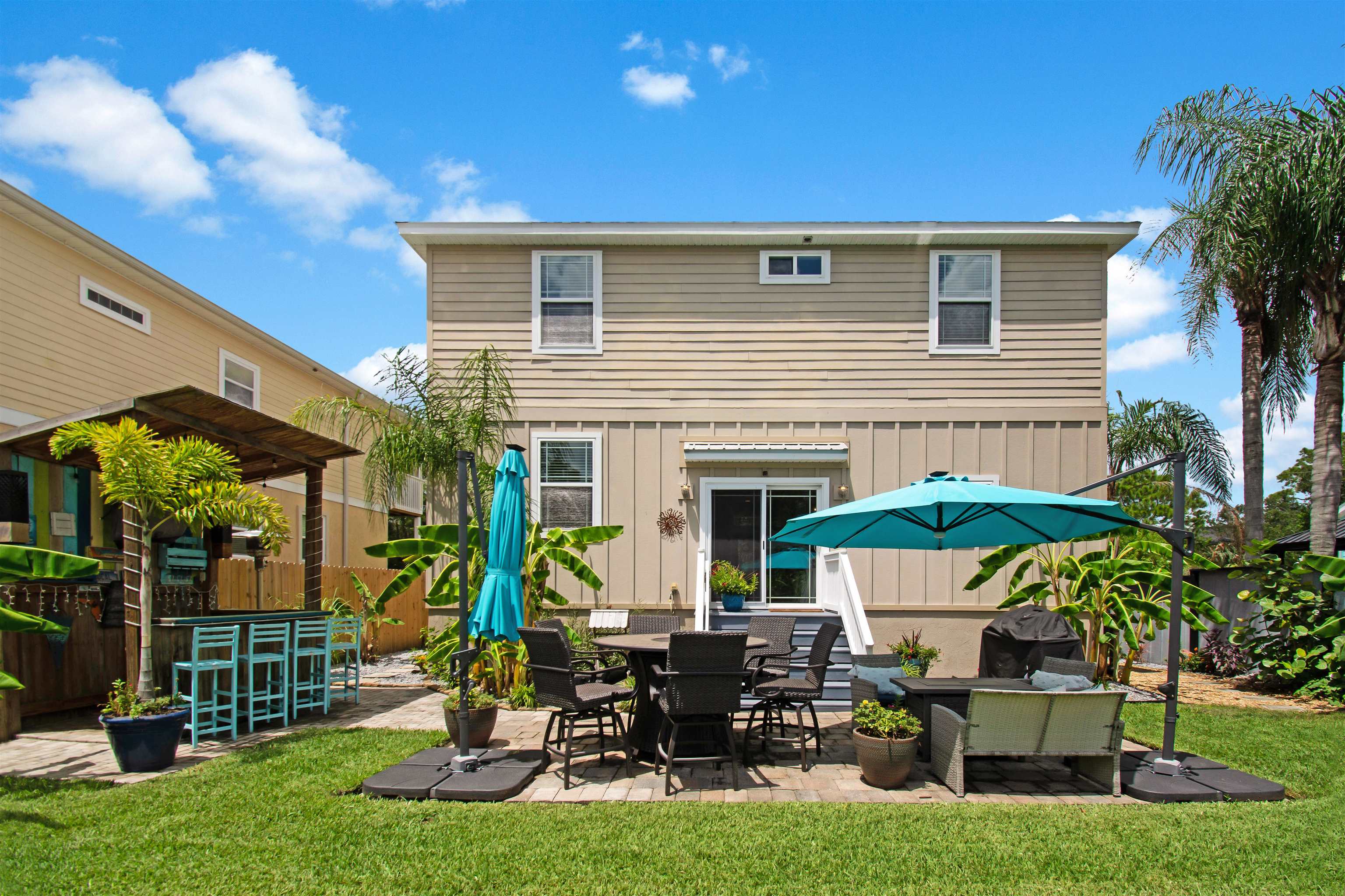 13 Court Edna St. Augustine, FL 32084 - Photo 14 of 59 a view of backyard with outdoor seating and plants