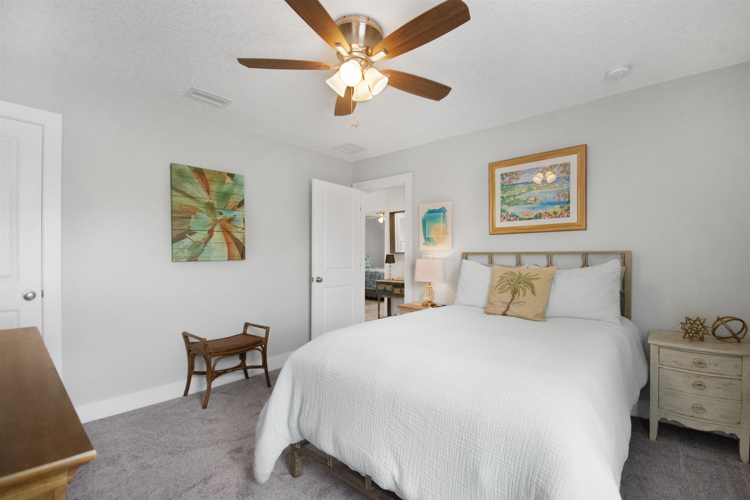 13 Court Edna St. Augustine, FL 32084 - Photo 26 of 59 a bedroom with a bed and a chandelier
