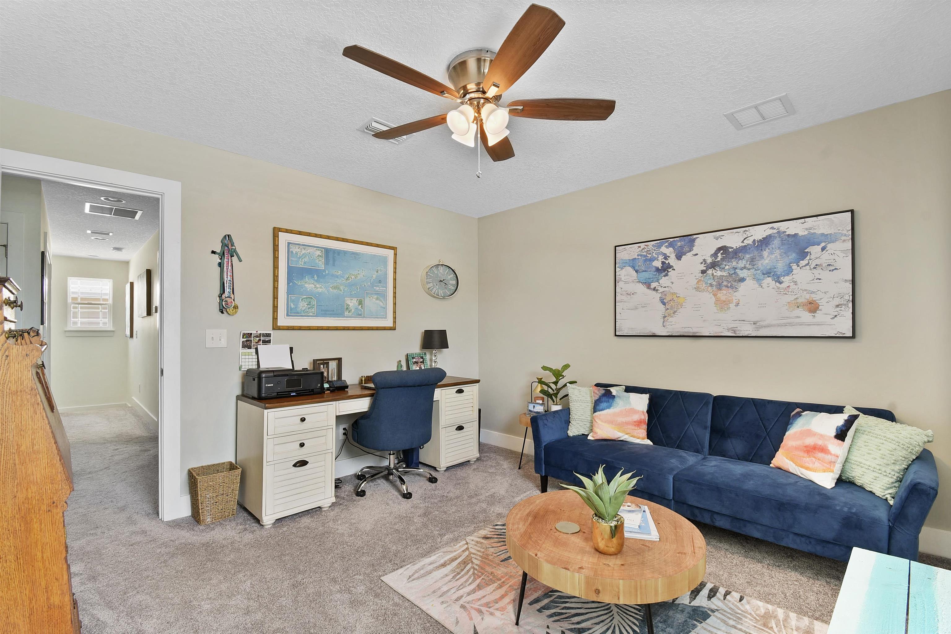 13 Court Edna St. Augustine, FL 32084 - Photo 29 of 59 a living room with furniture a rug and a ceiling fan