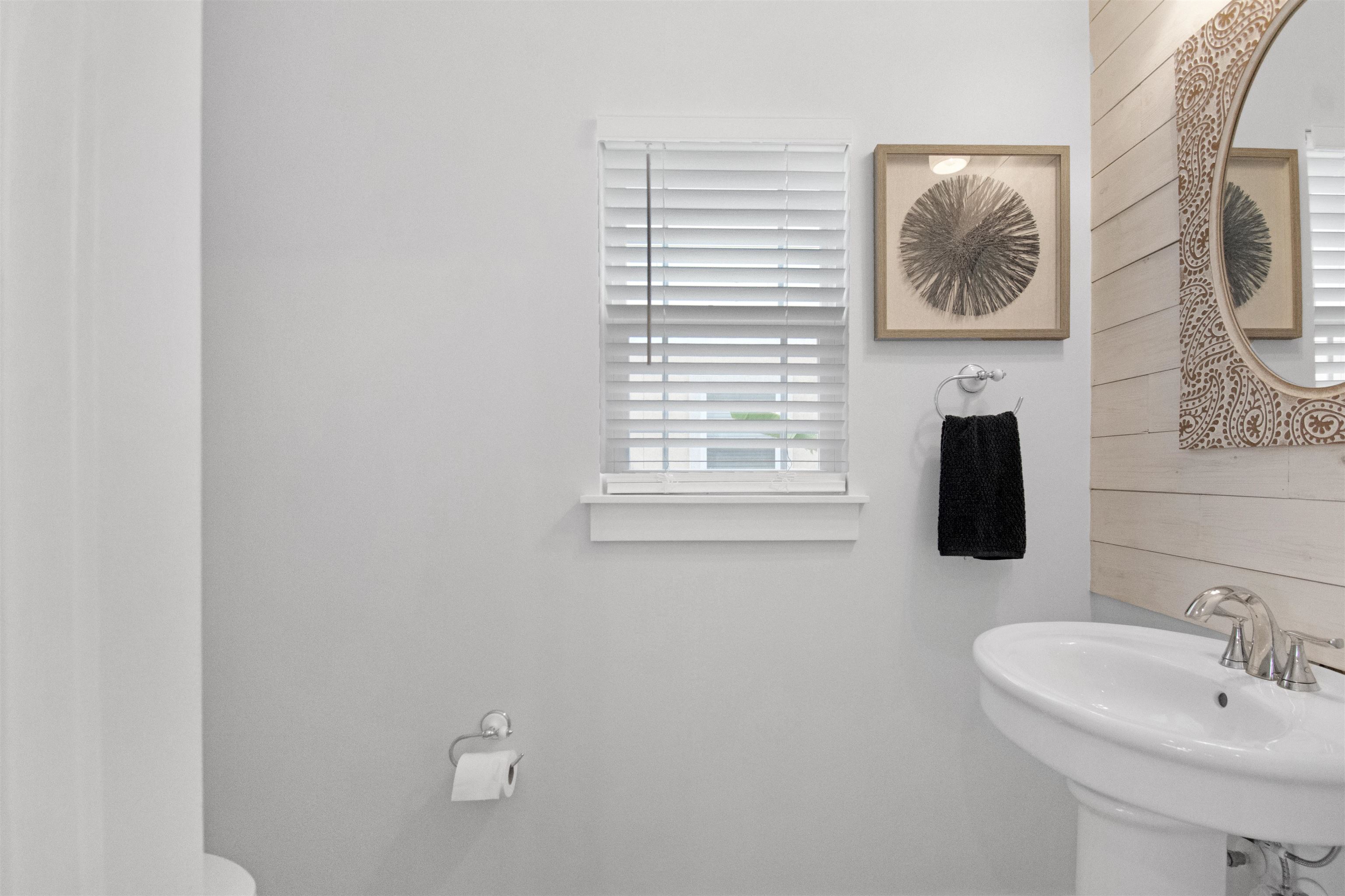 13 Court Edna St. Augustine, FL 32084 - Photo 30 of 59 a bathroom with a sink and a mirror