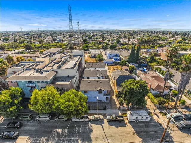 an aerial view of residential houses with outdoor space