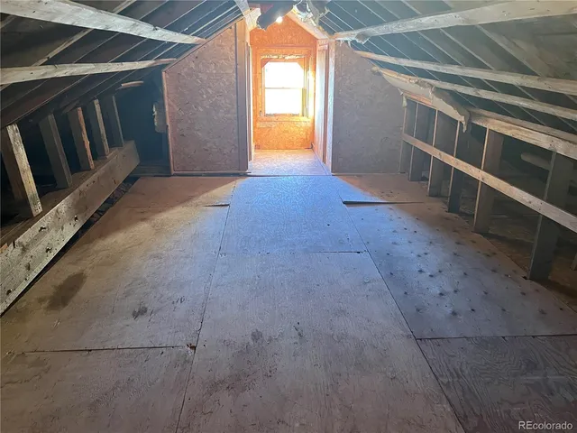a view of an empty room and window in a room