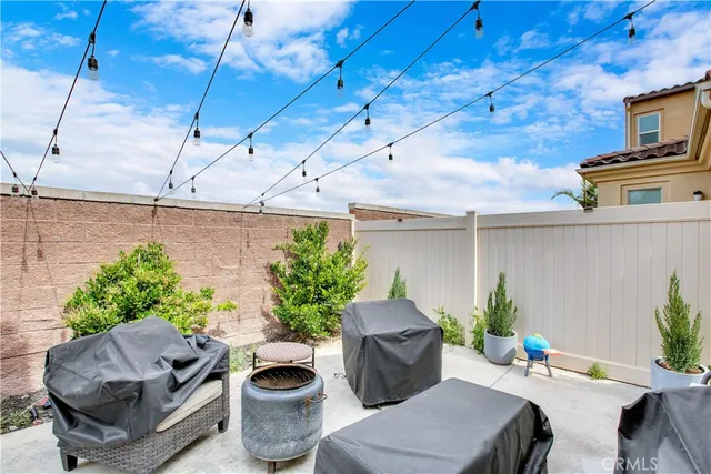 a work room with furniture and a potted plant