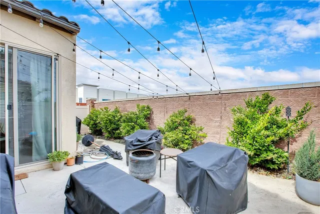 a outdoor space with patio furniture and potted plants
