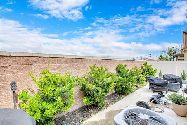 a view of a backyard with plants and a garden