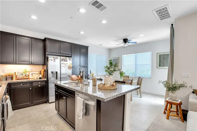 a kitchen with granite countertop a sink and stove