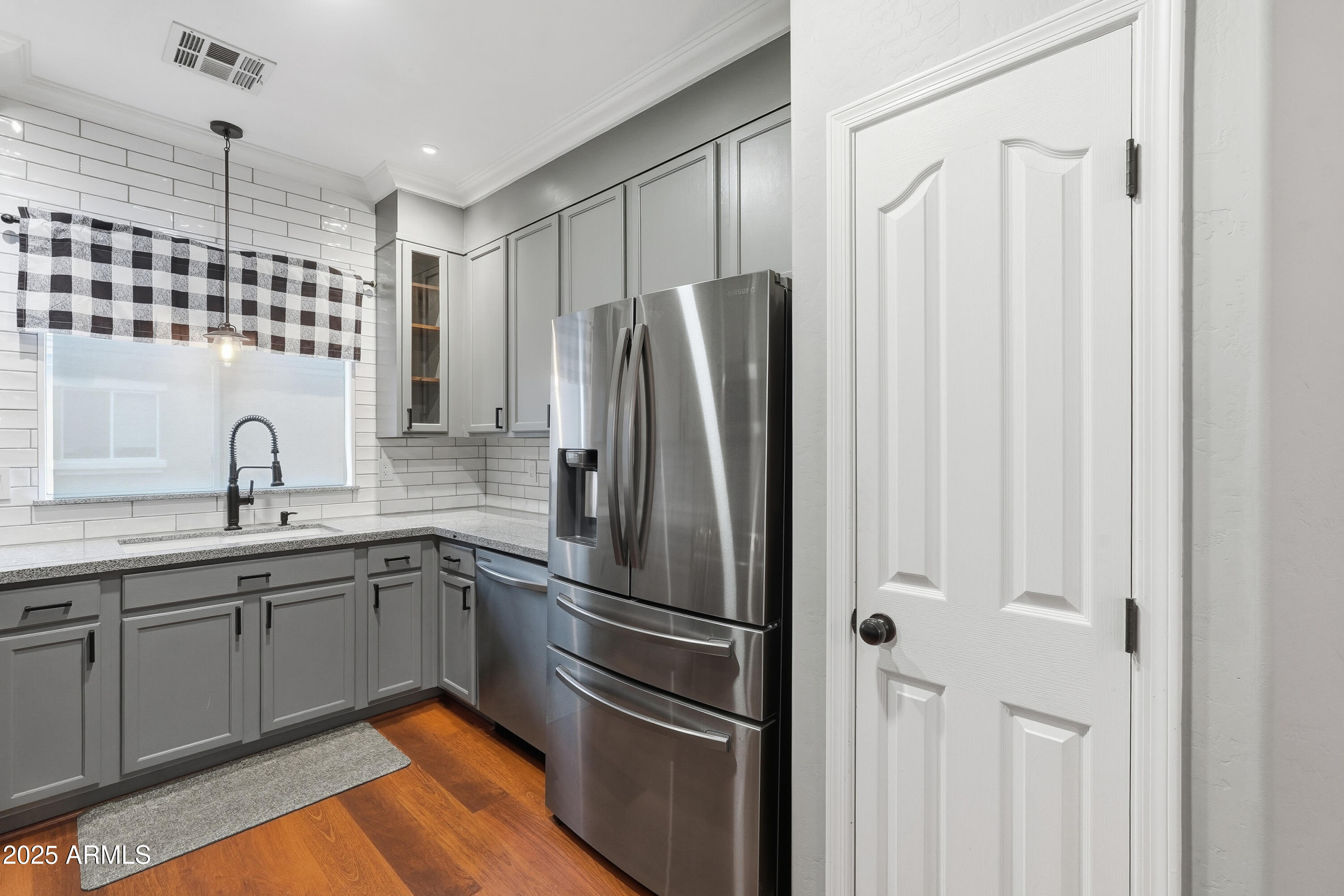 162 West Commerce Court Gilbert, AZ 85233 - Photo 11 of 29 a kitchen with stainless steel appliances a refrigerator sink and cabinets