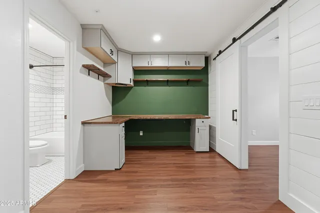 a view of room with window and wooden floor
