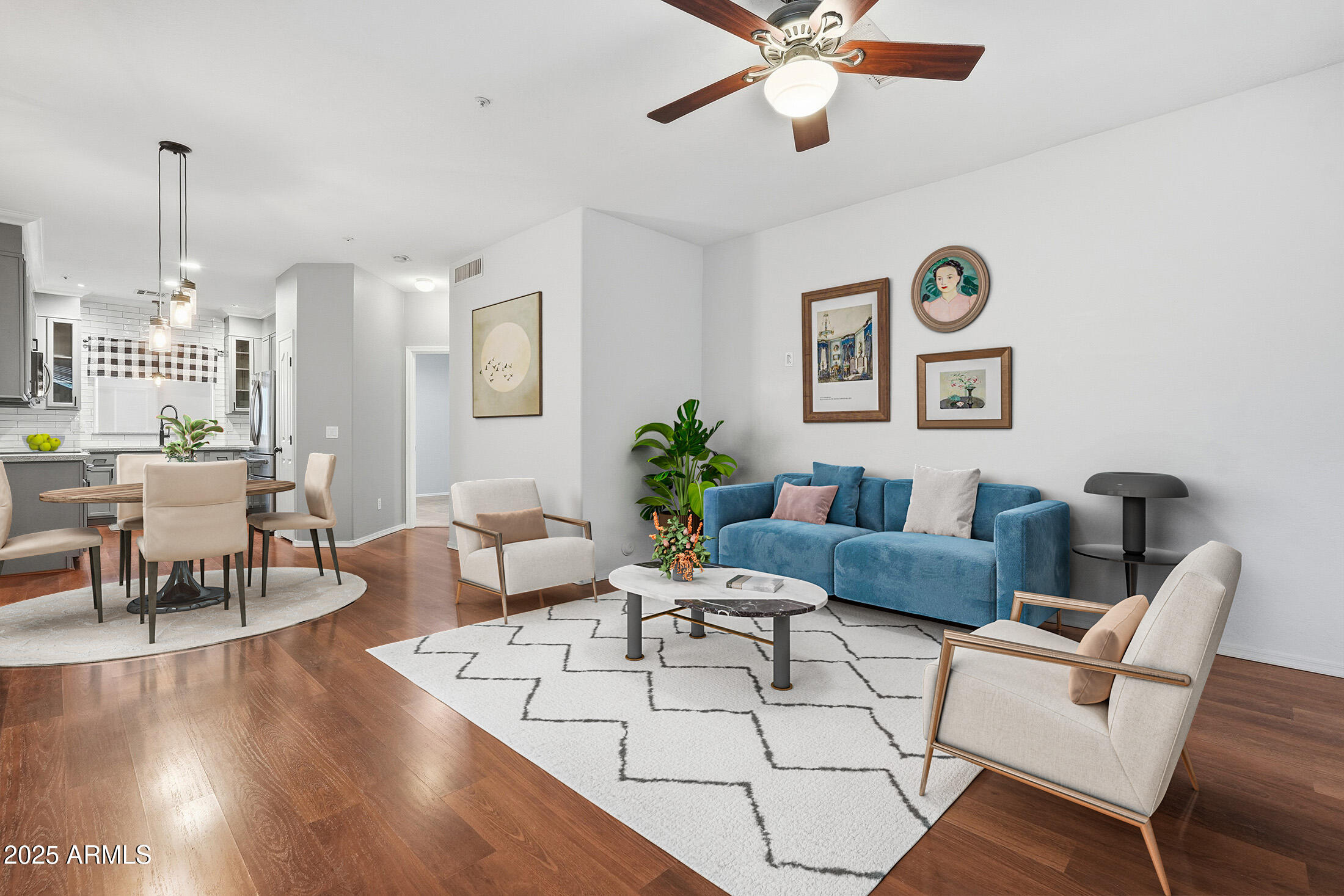 162 West Commerce Court Gilbert, AZ 85233 - Photo 2 of 29 a living room with furniture and a chandelier