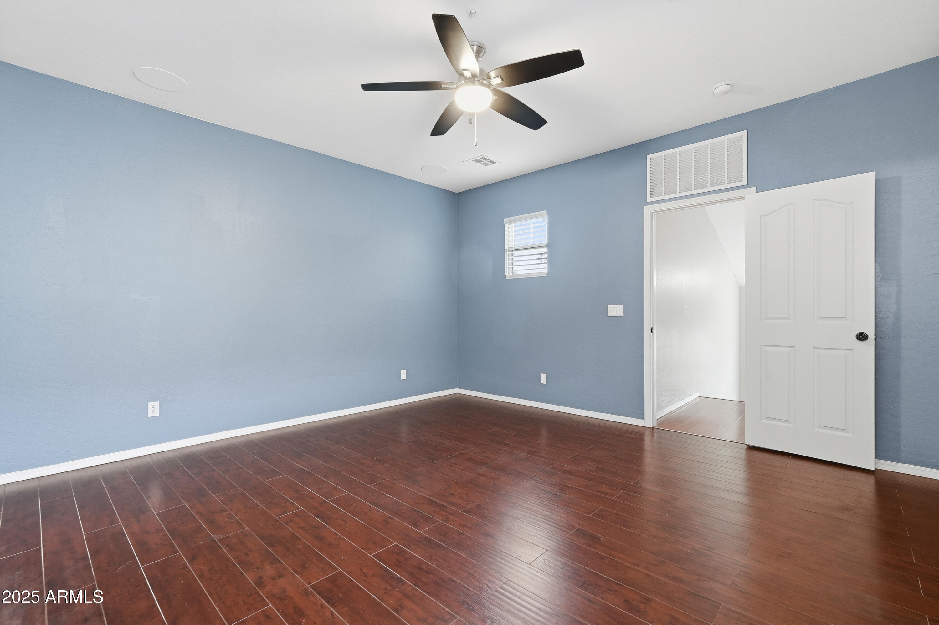 162 West Commerce Court Gilbert, AZ 85233 - Photo 22 of 29 a view of an empty room with wooden floor